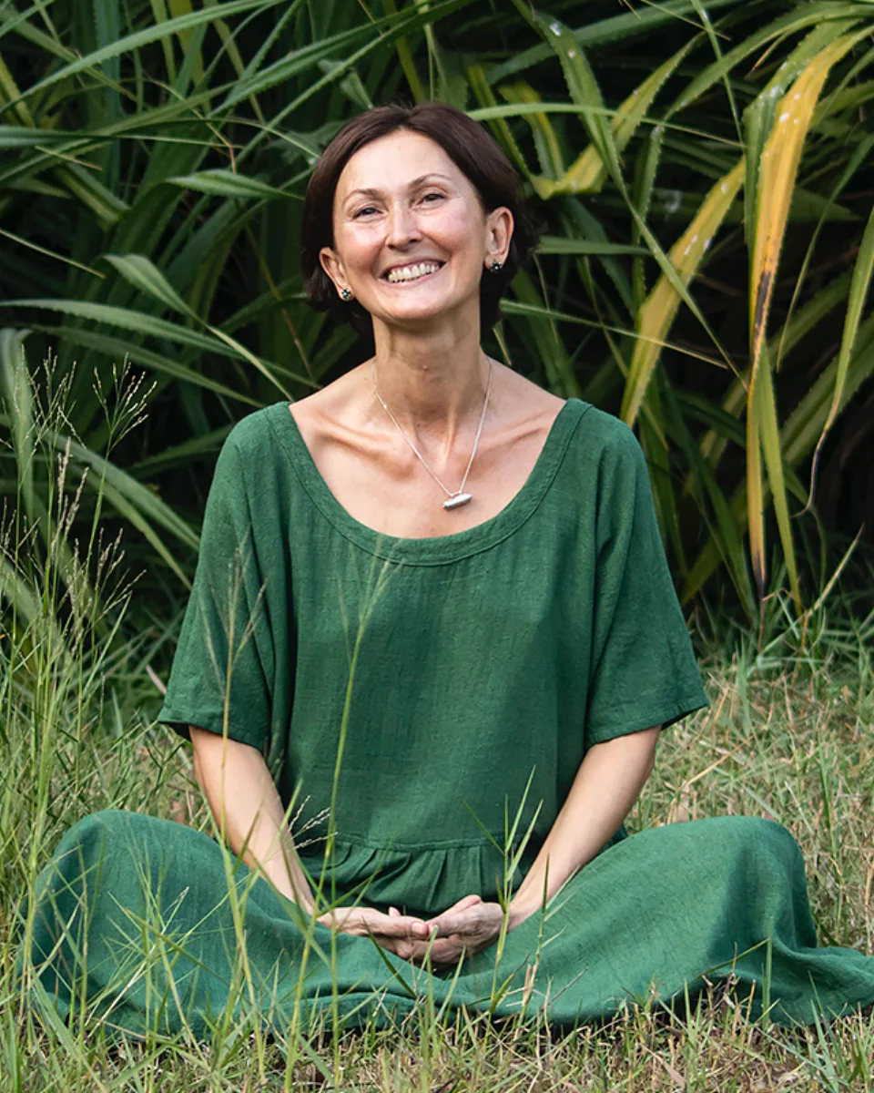Sarita Arya seated in green in a garden