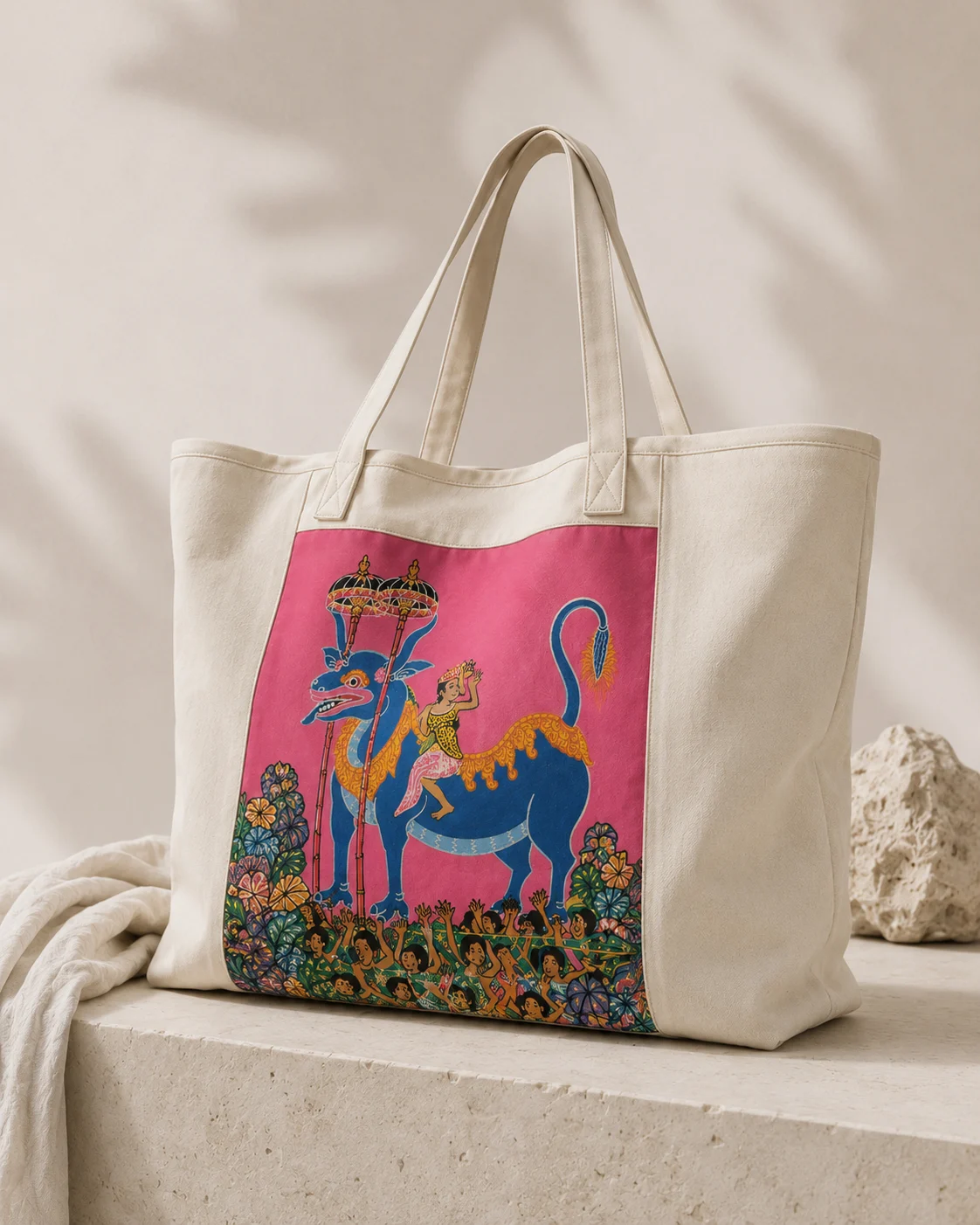 A staged DreamSupreme tote carrying a pink dragon motif adapted from I Wayan Pugur’s work